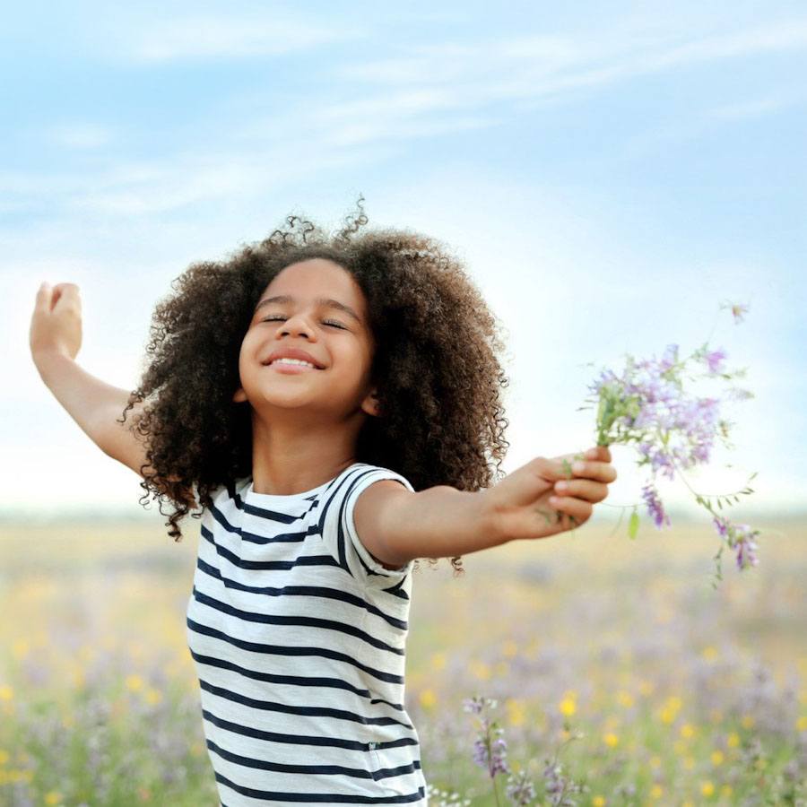 A happy girl in a field