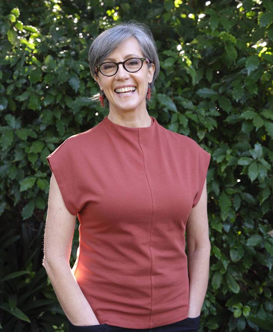 Joanne Lipinski smiling in her garden
